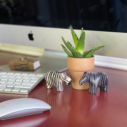 Complementary soapstone zebras perfect for desk or shelf decor