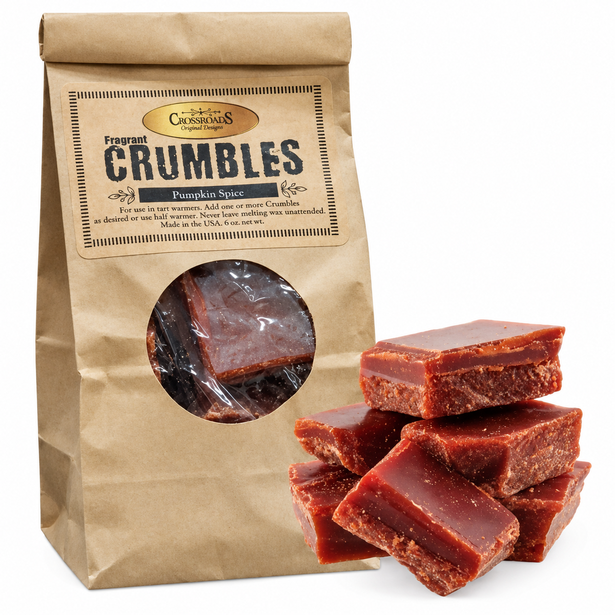 A kraft paper bag of Crumbles Fragrant Crumbles Pumpkin Spice candy with several pieces of the reddish-brown candy displayed in front on a white background.