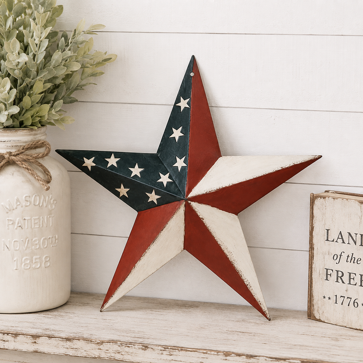 Americana metal barn star with a red, white, and blue American flag-inspired finish displayed for farmhouse wall décor