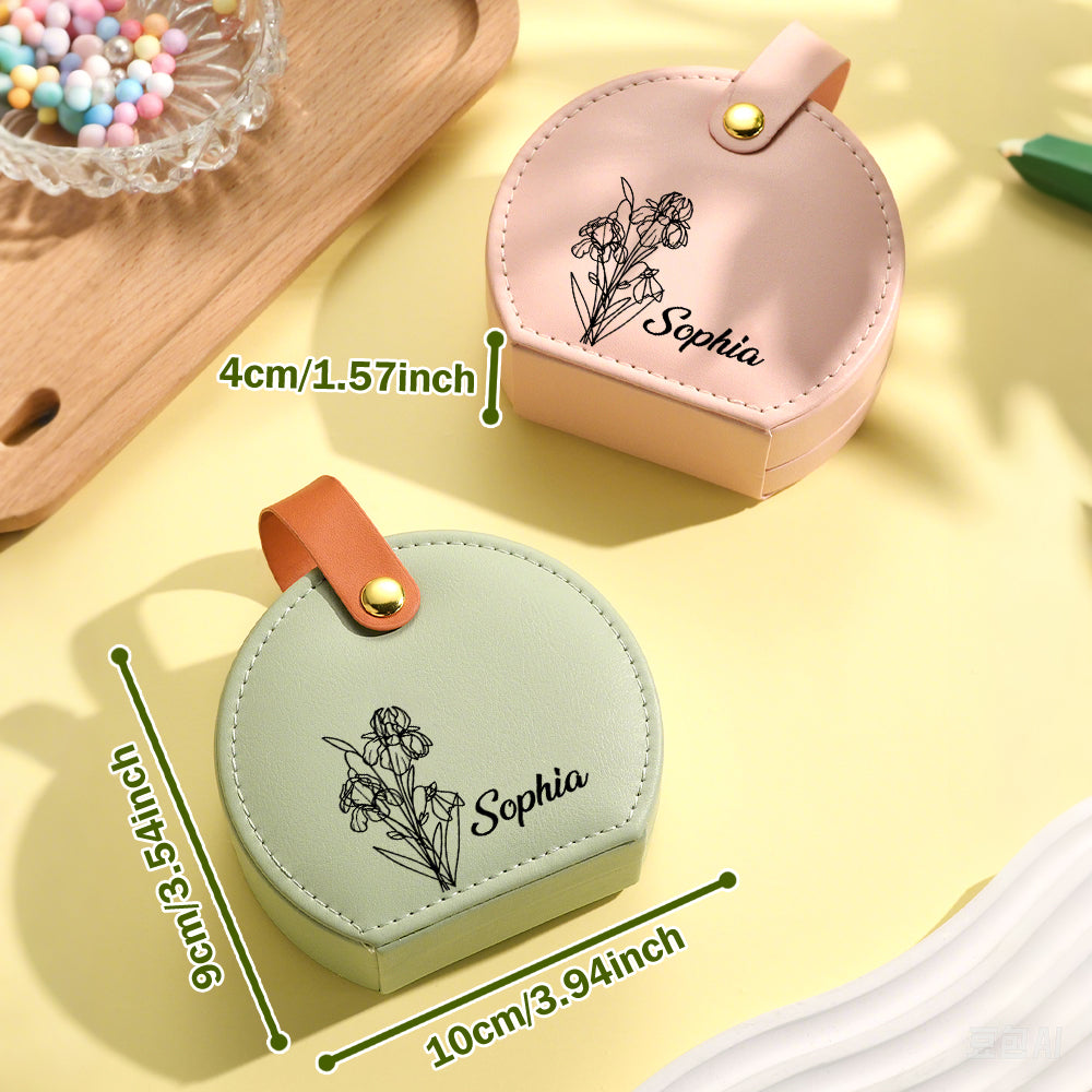 Side-by-side view of pink and green birth flower jewelry boxes, with one case displaying measurement details, showing its compact size for travel and storage.