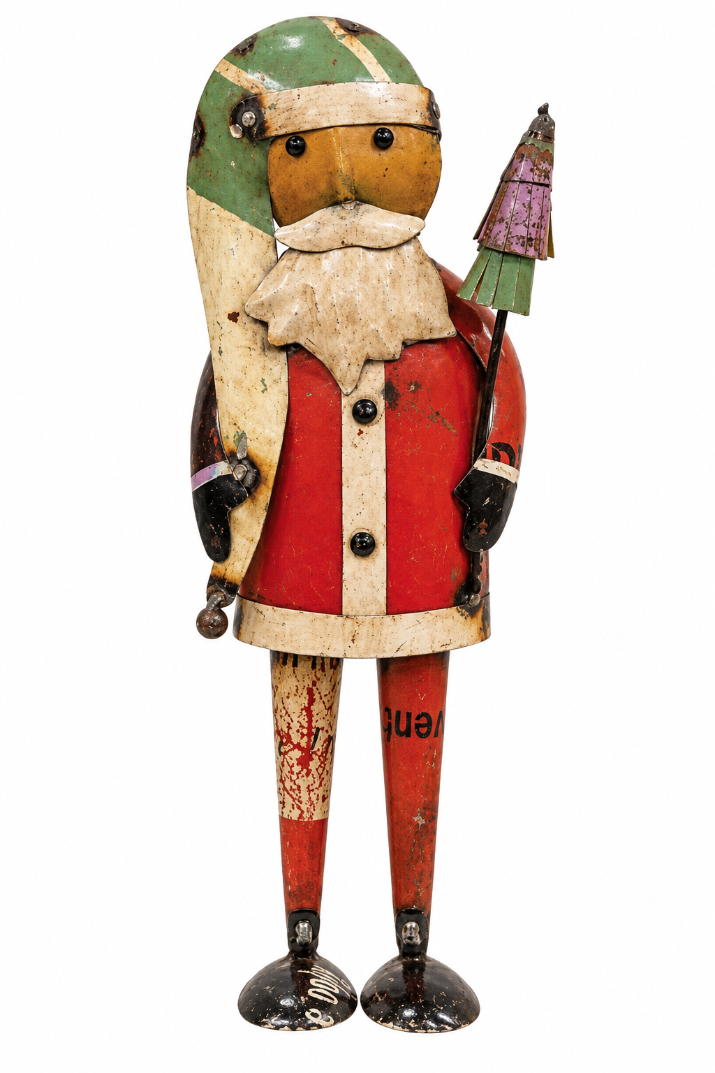 A vintage painted tin Santa Claus figurine holding a small Christmas tree, isolated on a white background.