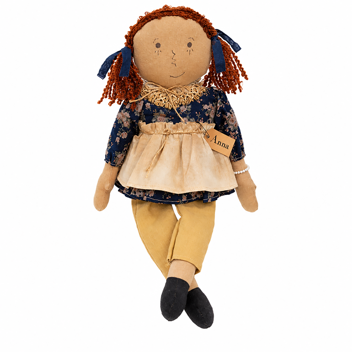 Primitive country rag doll shelf sitter named Anna with stitched facial features, dark red yarn pigtails, floral clothing, and rustic farmhouse décor.