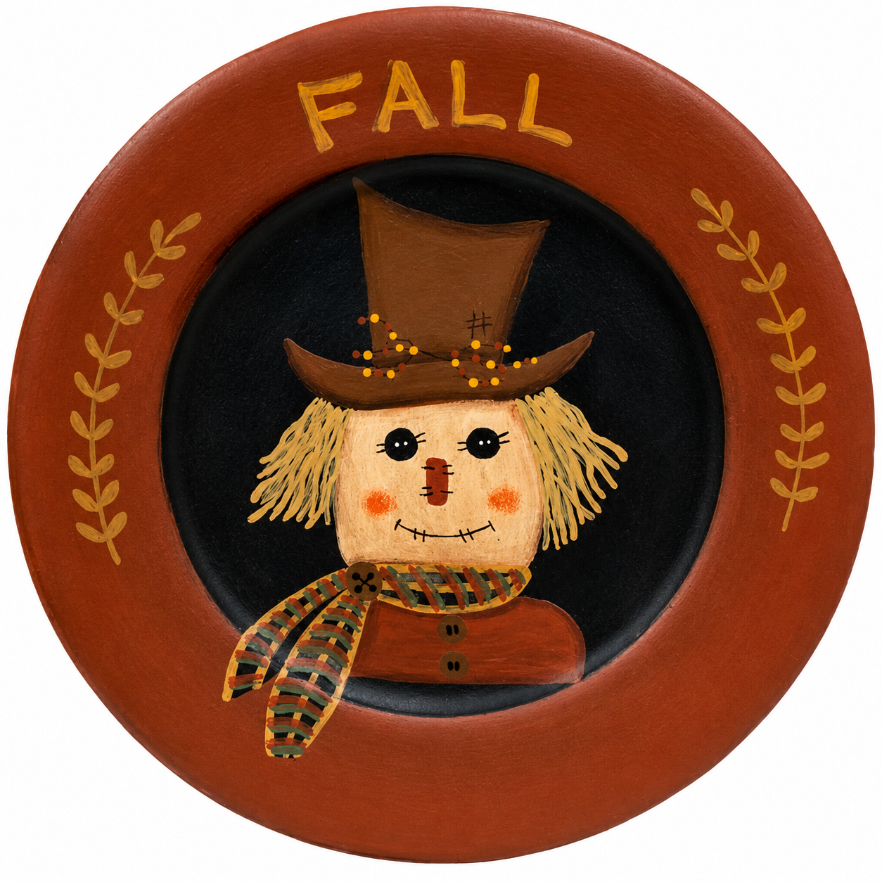 Primitive wooden fall plate with painted scarecrow, plaid scarf, brown leaf accents and the word fall in orange.