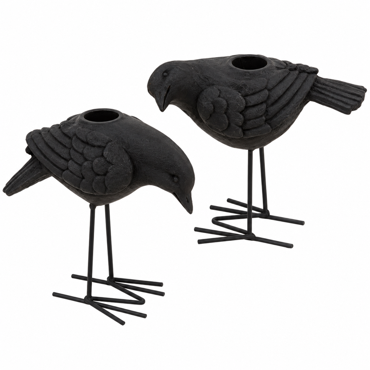 Two black bird-shaped candle holders with textured feathers and thin metal legs, shown on a plain white background.