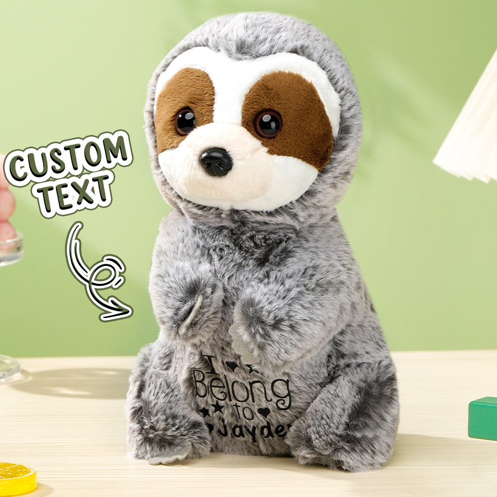 A close-up view of the personalized sloth plush toy with a text overlay that says "custom text," highlighting the option for customization with the baby’s name.