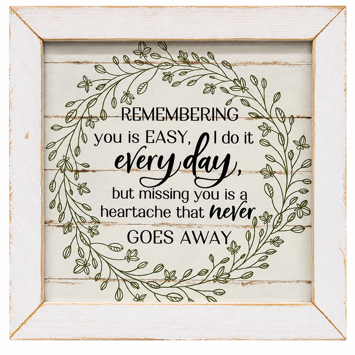 A square decorative wall sign with a distressed white wood frame. The center features a rustic off-white wood plank background with a green leafy wreath illustration surrounding a sentimental quote about remembering someone daily.
