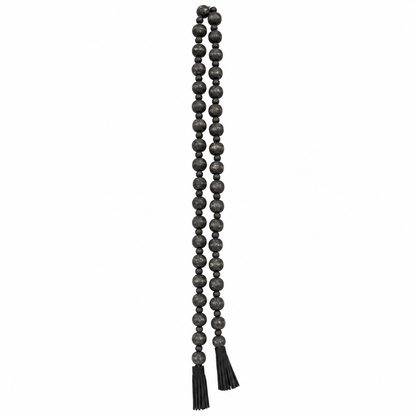 48-inch black wooden bead garland with distressed finish and suede tassels displayed as a decorative accent.