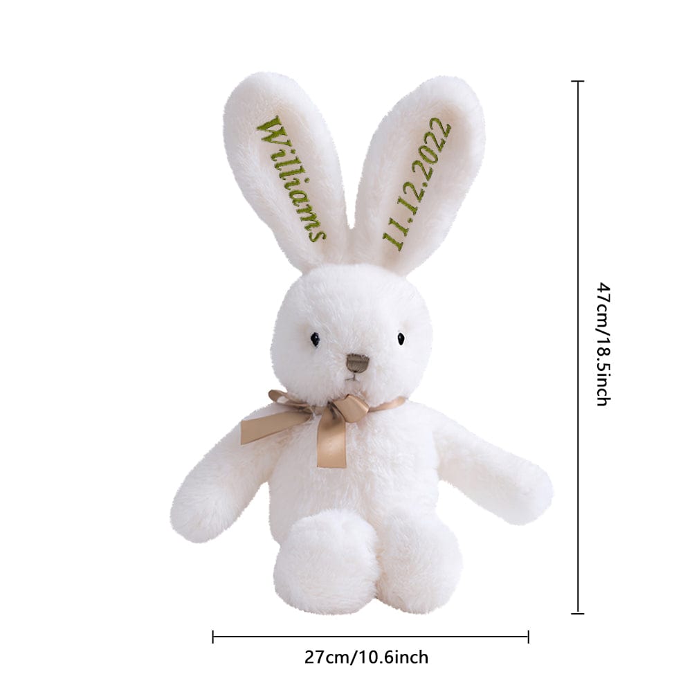 Bunny with size reference overlay – A white bunny with green embroidery displayed with an overlay indicating dimensions.