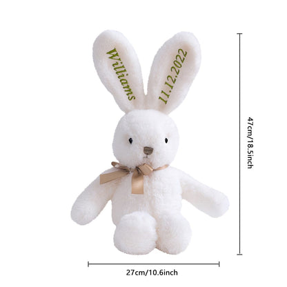 Bunny with size reference overlay – A white bunny with green embroidery displayed with an overlay indicating dimensions.