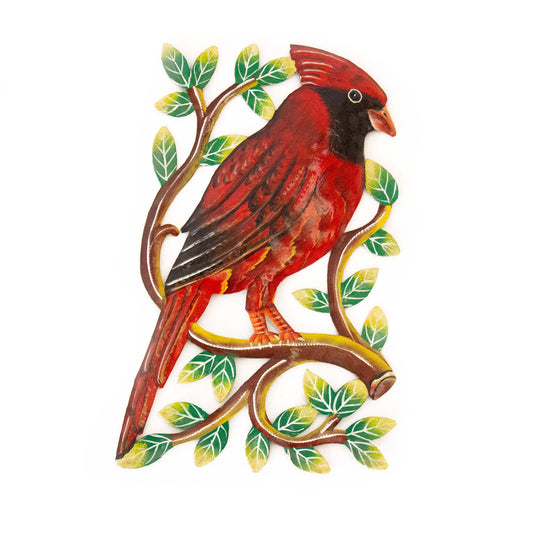 Painted metal wall art featuring a red cardinal perched on a branch