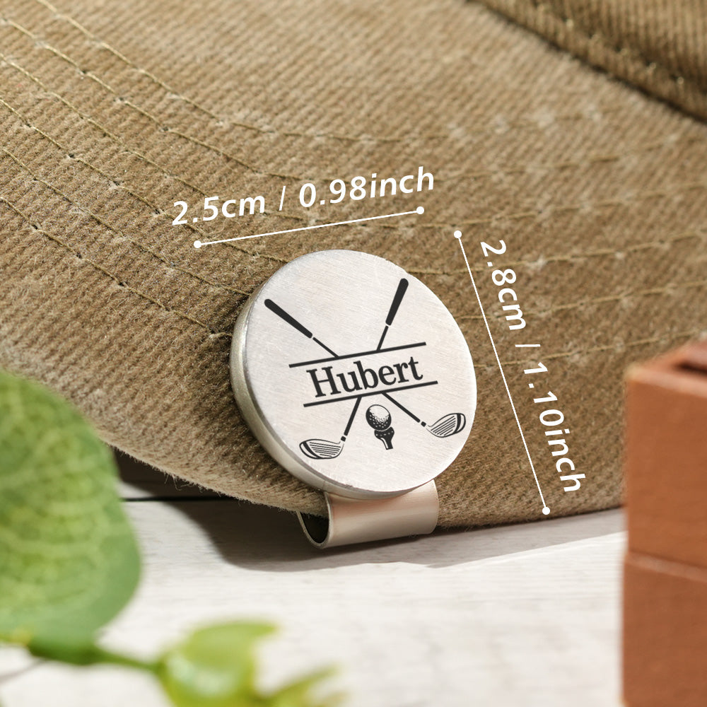 A personalized golf ball marker attached to the brim of a hat with the clip, displaying its compact size with measurement details indicated.