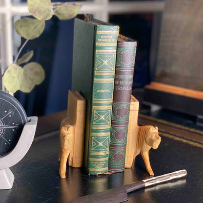 Artisan-carved bookends shaped like lions from Kenya