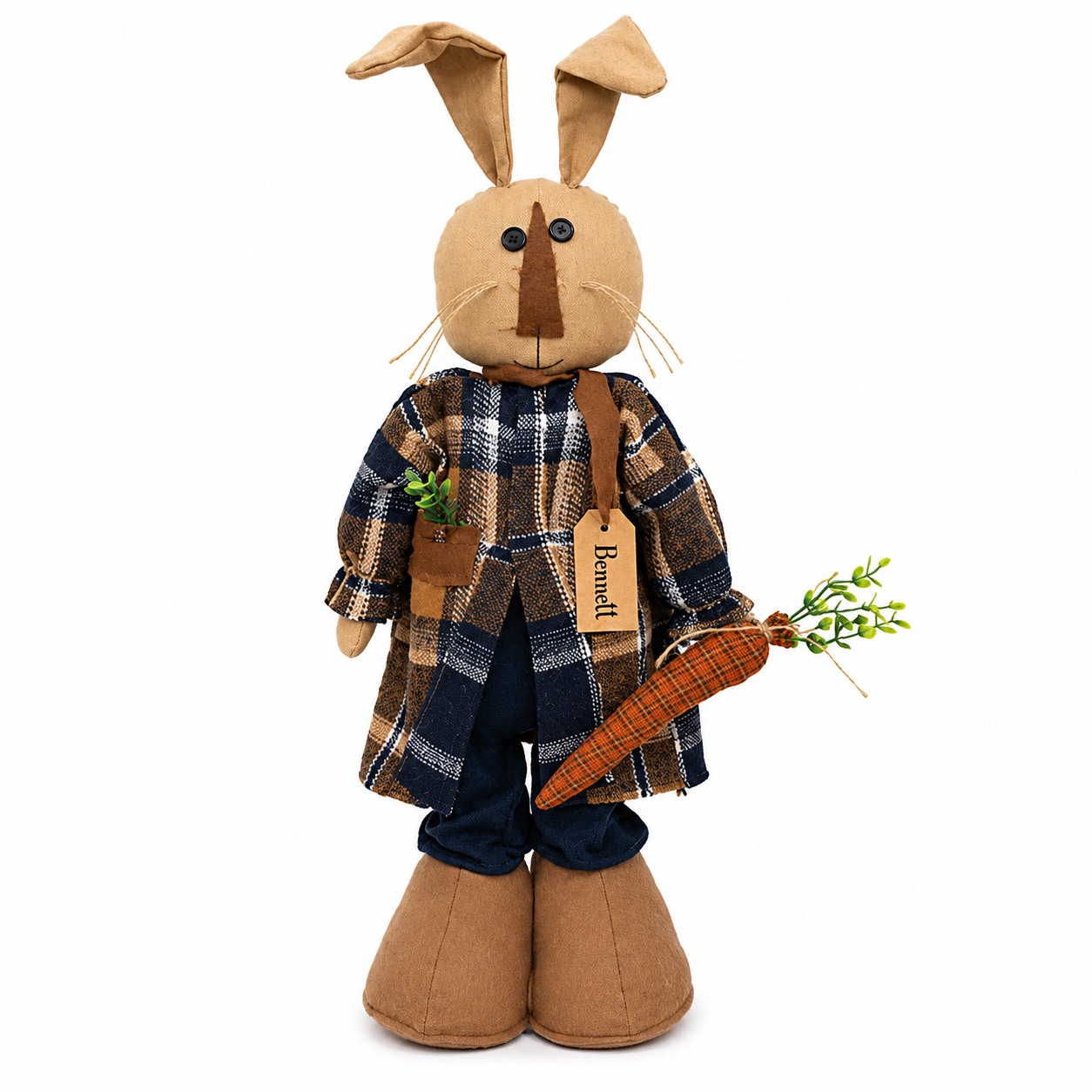 Freestanding primitive stuffed bunny with posable ears, patchwork orange nose, button eyes, faux greenery pocket, and plush carrot for country farmhouse spring decorating.