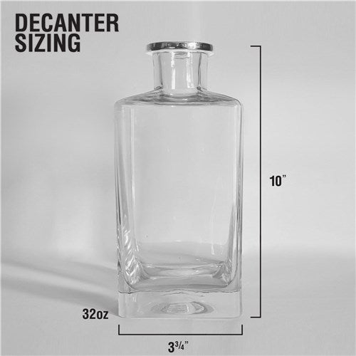Square hand-blown glass decanter with dome topper displayed on bar cart