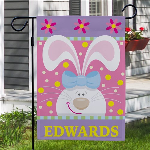Close-up of a personalized garden flag featuring a cute bunny design and a 2" pocket for hanging on a flagpole (not included).