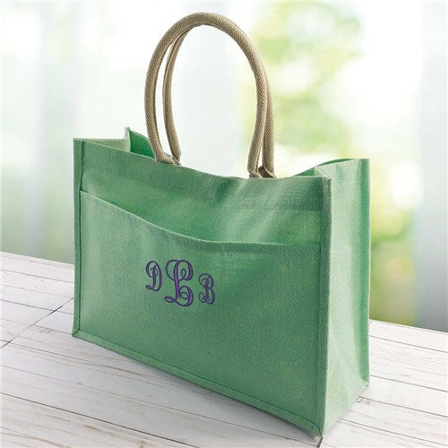 Mint green monogram jute tote with front pocket and white embroidered initials