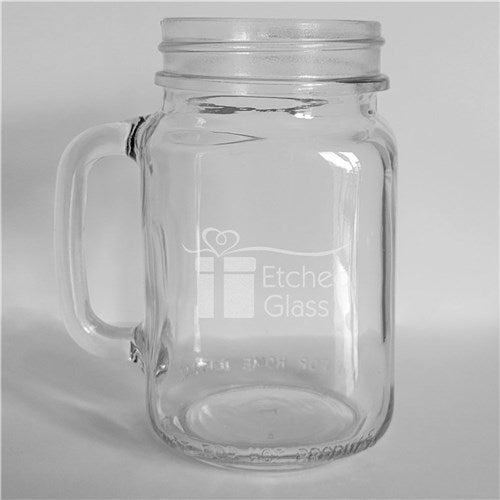 Close-up of monogrammed glass mason jar with nautical-themed engraving